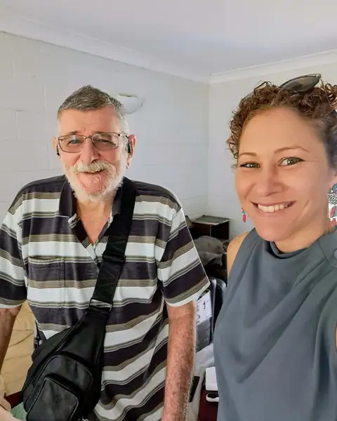 A Transformative Nursing team member with a smiling client at home