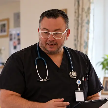 Sean Burnett, Clinical Nurse Consultant, during a home nursing visit